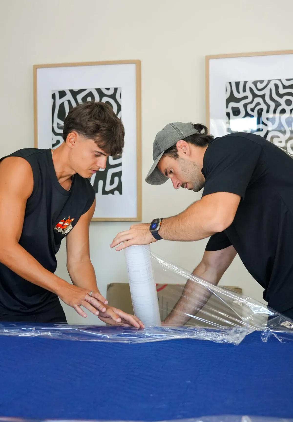 KangPack mover wrapping and protecting furniture