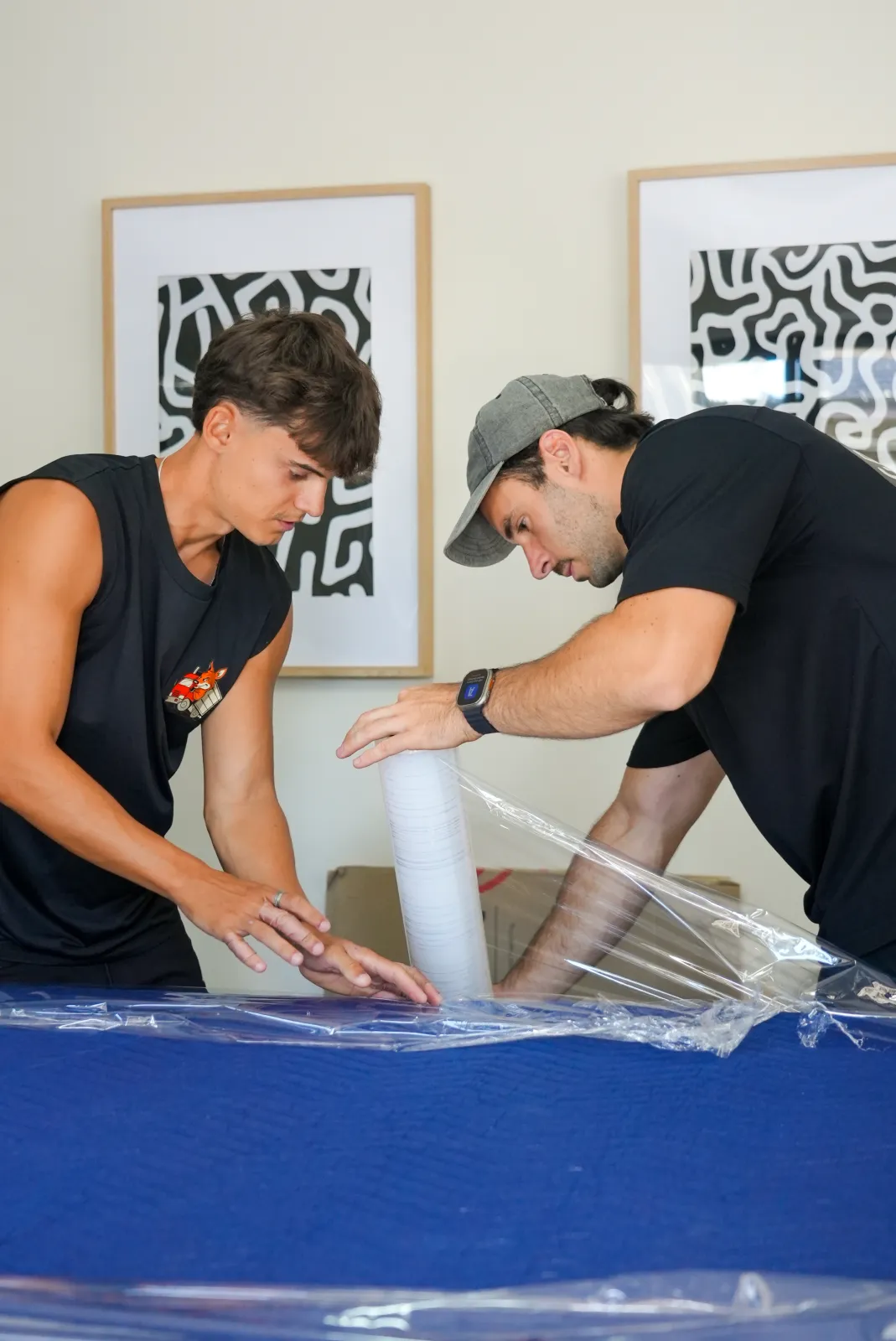 KangPack movers carefully wrapping and packing items during a Sydney house move