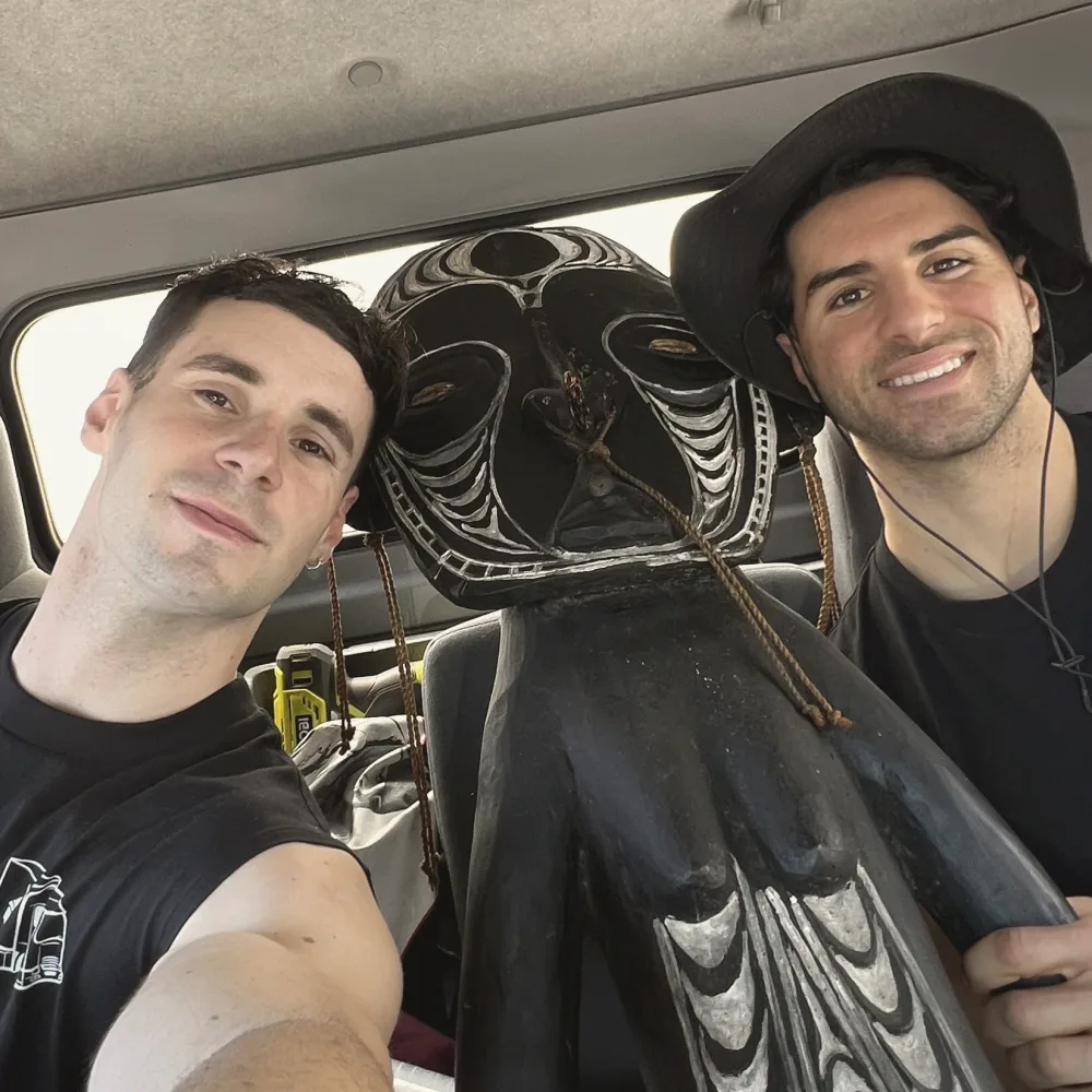Theo and Faus in the truck cabin during a move