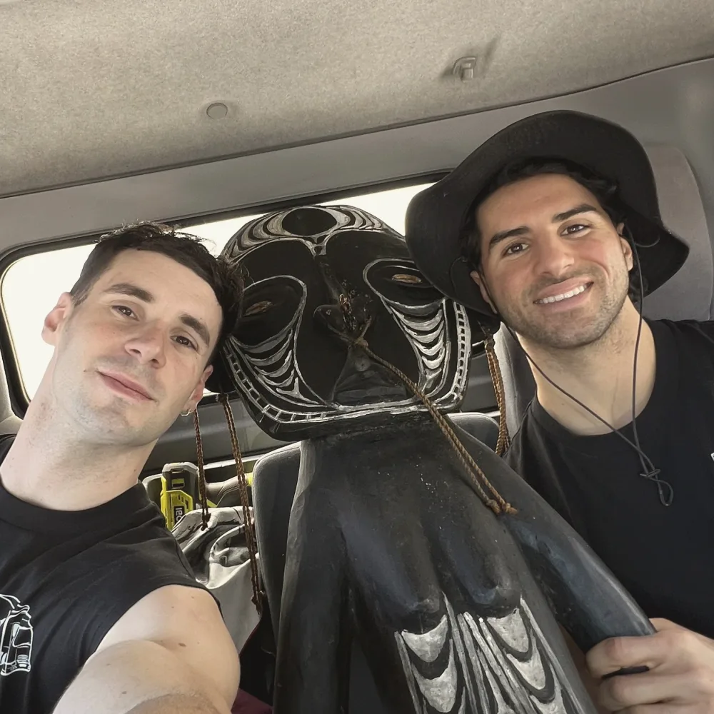 Theo and Faus in the truck cabin during a move